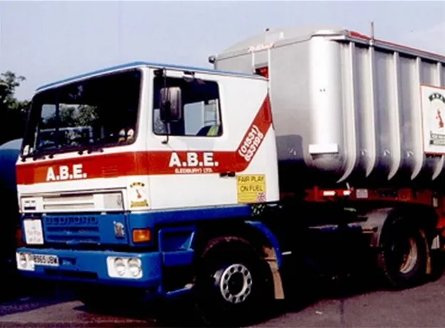 Classic ABE Ledbury lorry with red, white, and blue livery pulling a silver bulk goods trailer.