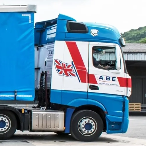 Side profile of an ABE lorry with a large blue curtain-sided trailer branded with A.B.E. in bold white letters.